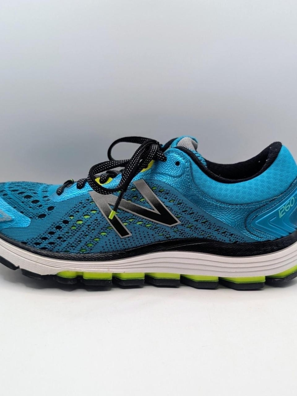 Women’s New Balance 1260v7 running shoes in Pisces blue with lime green accents - Picture 5 of 7